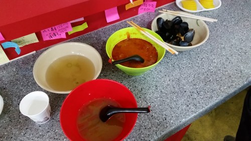 Broth in the white bowl and the finished bowl in the green!